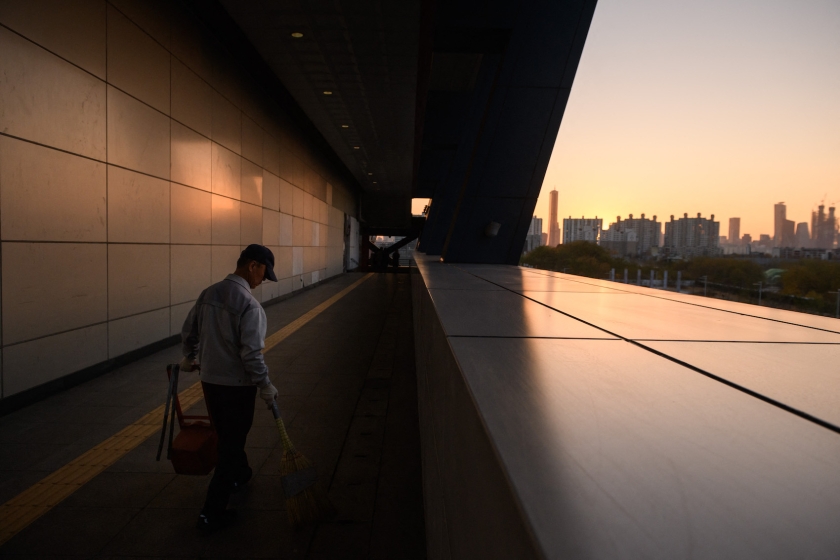 A man clean up rubbish in a high-rise