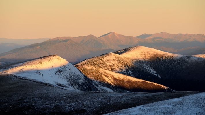 A mountain range at sunrise.