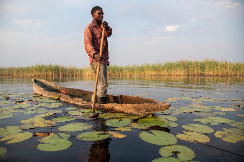 A man in a dugout canoe